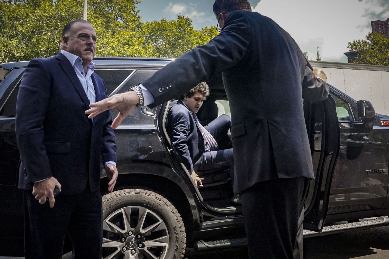 FTX co-founder Sam Bankman-Fried, center, arrives at a federal court in New York on Friday, August 11. <a href="https://www.cnn.com/2023/08/11/business/sam-bankman-fried-bail-hearing/index.html" target="_blank">A federal judge revoked his bail</a>, citing probable cause that the accused crypto fraudster attempted to tamper with witnesses. Bankman-Fried's lawyers immediately filed a notice of appeal. Bankman-Fried has pleaded not guilty to multiple conspiracy and fraud charges. His trial date is set for October.