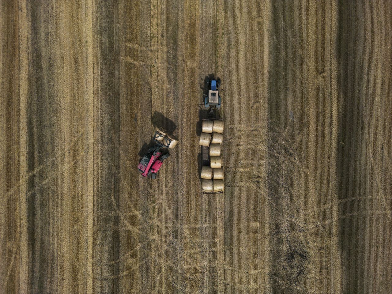 This photo, taken with a drone on Thursday, August 10, shows agricultural machinery on a farm in Ukraine's Kyiv region. Last month, Russia said it was suspending its participation in a crucial deal that allowed the export of Ukrainian grain. <a href="https://www.cnn.com/2023/07/17/business/grain-deal-global-food-prices-explainer/index.html" target="_blank">The collapse of the pact</a> threatened to push up food prices for consumers worldwide and tip millions into hunger.