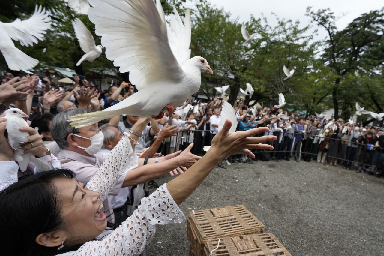 Doves are released at the Yasukuni Shrine in Tokyo on Tuesday, August 15, as part of an annual memorial service for those killed during World War II.