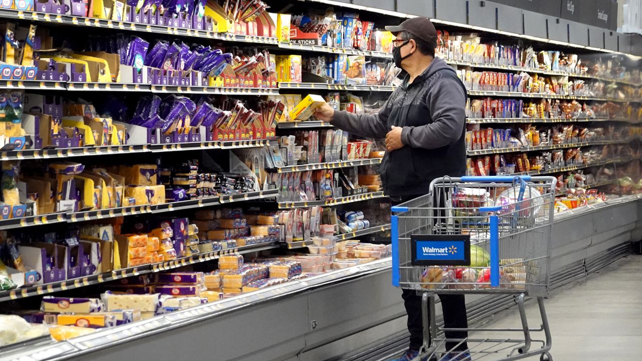 Customers shop at a Walmart store on May 18, 2023 in Chicago, Illinois. 