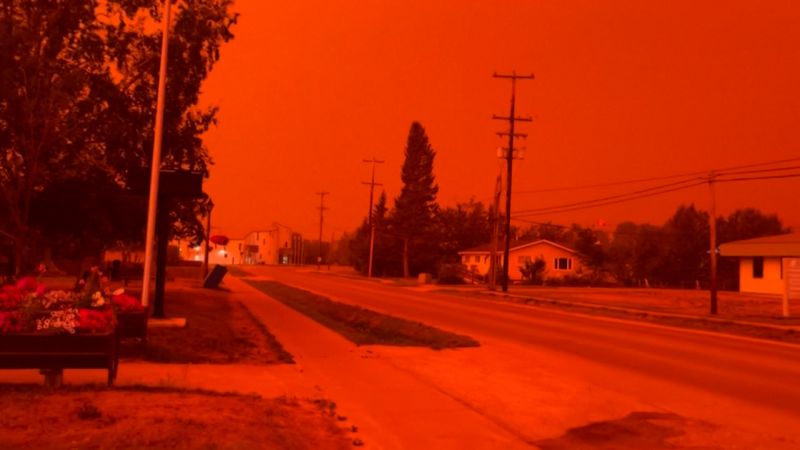 Surreal video shows wildfire turning sky red in Canada