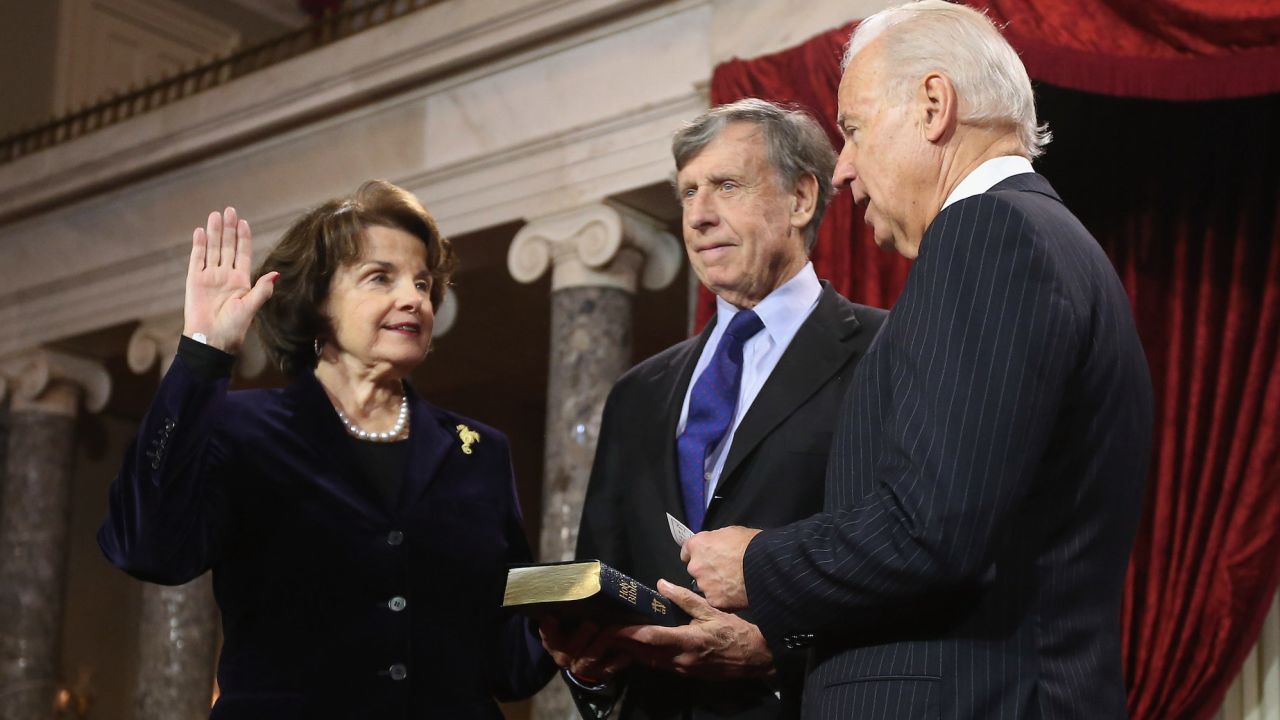 Sen. Dianne Feinstein participates in a reenacted swearing-in with her husband Richard C. Blum and then-Vice President Joe Biden in the Old Senate Chamber at the U.S. Capitol January 3, 2013 in Washington, DC.