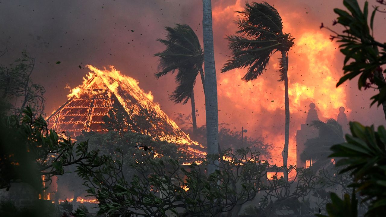 The hall of historic Waiola Church in Lahaina and nearby Lahaina Hongwanji Mission are engulfed in flames along Wainee Street on Tuesday, Aug. 8, 2023, in Lahaina, Hawaii. (Matthew Thayer/The Maui News via AP)