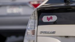 Lyft signage on a vehicle as it exits the ride-sharing pickup at San Francisco International Airport on Thursday, Feb. 3, 2022.  Photographer: David Paul Morris/Bloomberg via Getty Images