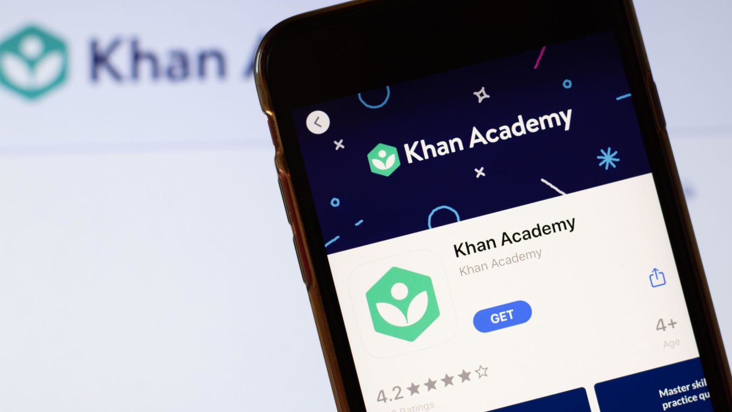 2B8X8PP Los Angeles, California, USA - 24 March 2020: Khan Academy app logo on phone screen close up with website on background with icon, Illustrative