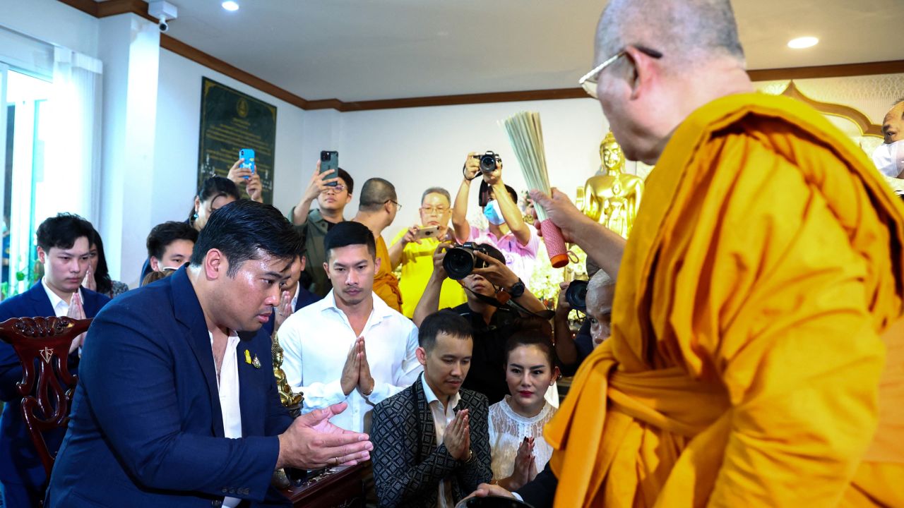 Vacharaesorn Vivacharawongse is blessed by a Buddhist monk during a religious ceremony at Wat Yannawa temple in Bangkok, Thailand, on August 10.