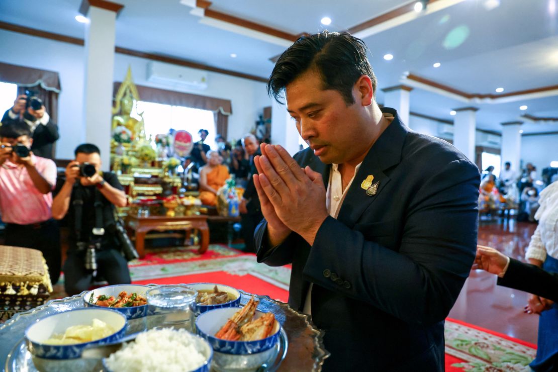 Vacharaesorn Vivacharawongse prays during a religious ceremony at Wat Yannawa temple in Bangkok, Thailand, August 10.