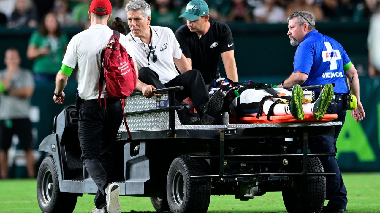 Philadelphia Eagles wide receiver Tyrie Cleveland (85) is brought off the field after an injury during the second half of an NFL preseason football game against the Cleveland Browns on Thursday, Aug. 17, 2023, in Philadelphia. (AP Photo/Derik Hamilton)