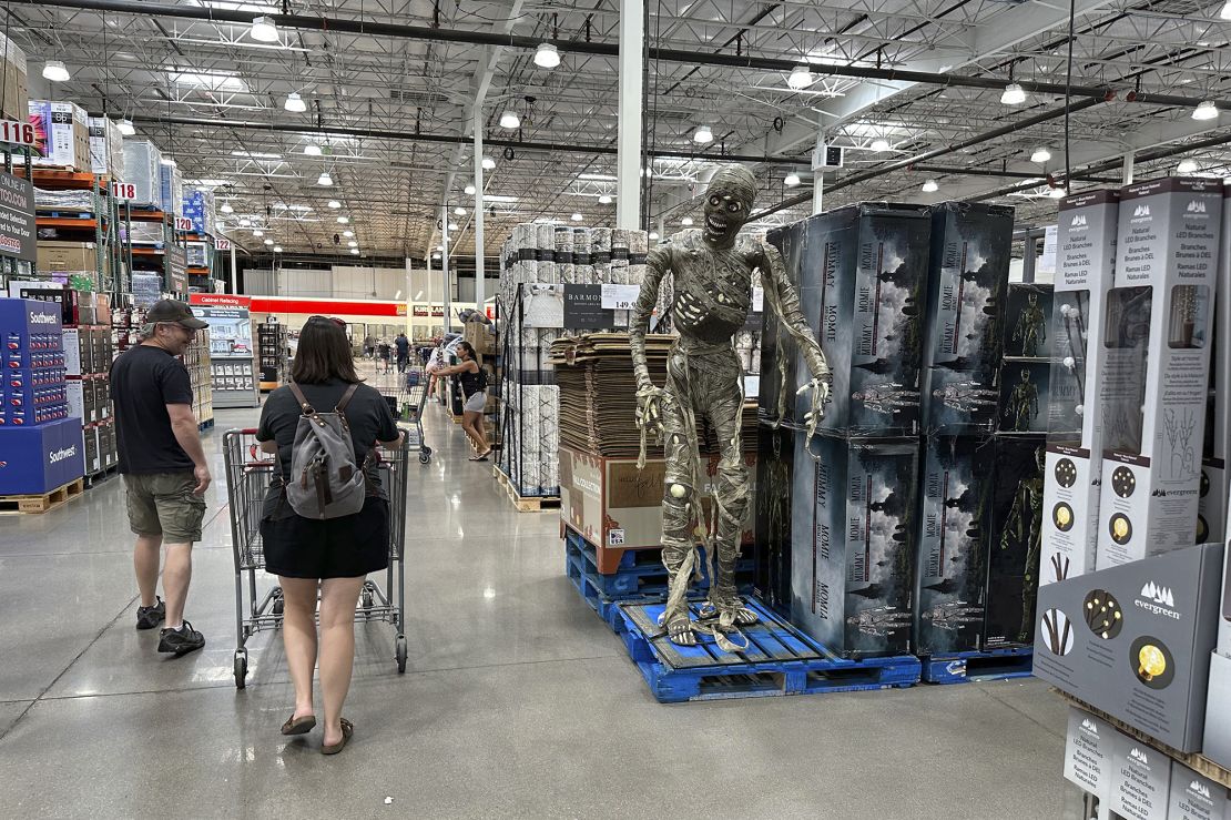Shoppers pass by a display of Halloween goods in a Costco warehouse Friday, Aug. 4, 2023, in Thornton, Colo. 