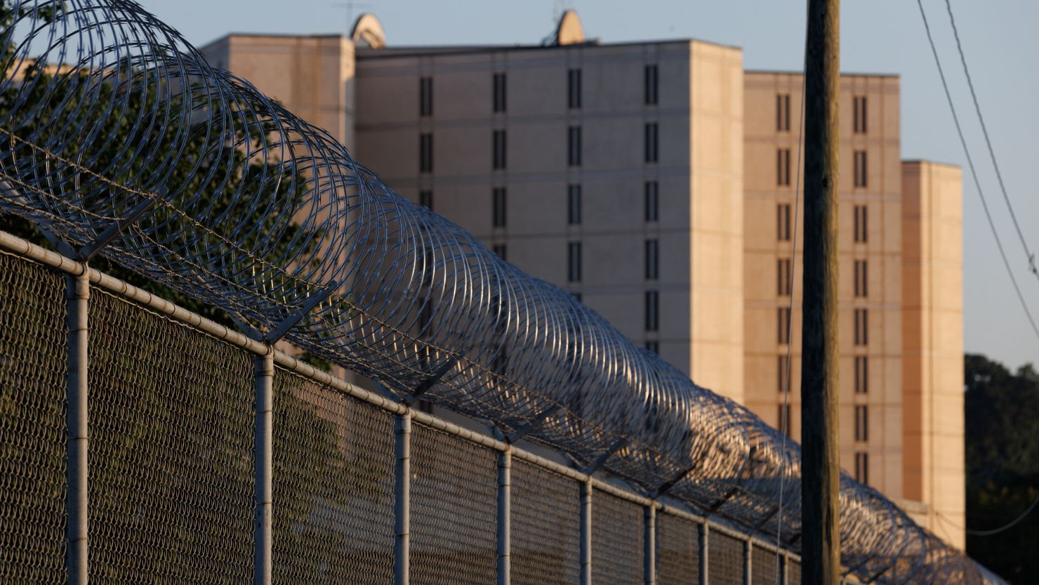 Razor wire lines the outside of the Fulton County Jail after a Grand Jury brought back indictments against former US President Donald Trump and 18 of his allies in their attempt to overturn the state's 2020 election results in Atlanta, August 18, 2023. 