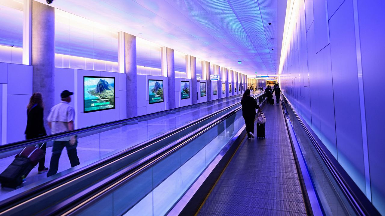 Moving walkways, like this one at Los Angeles International Airport, are crucial.