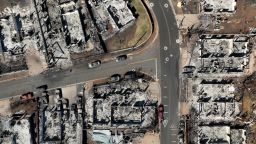 LAHAINA, HAWAII - AUGUST 17: In an aerial view, burned cars and homes are seen a neighborhood that was destroyed by a wildfire on August 17, 2023 in Lahaina, Hawaii. At least 111 people were killed and thousands were displaced after a wind driven wildfire devastated the towns of Lahaina and Kula early last week. Crews are continuing to search for missing people. (Photo by Justin Sullivan/Getty Images)