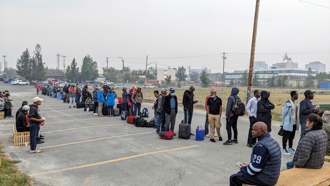 People line up in Yellowknife to register for an evactuation flight on August 17. 