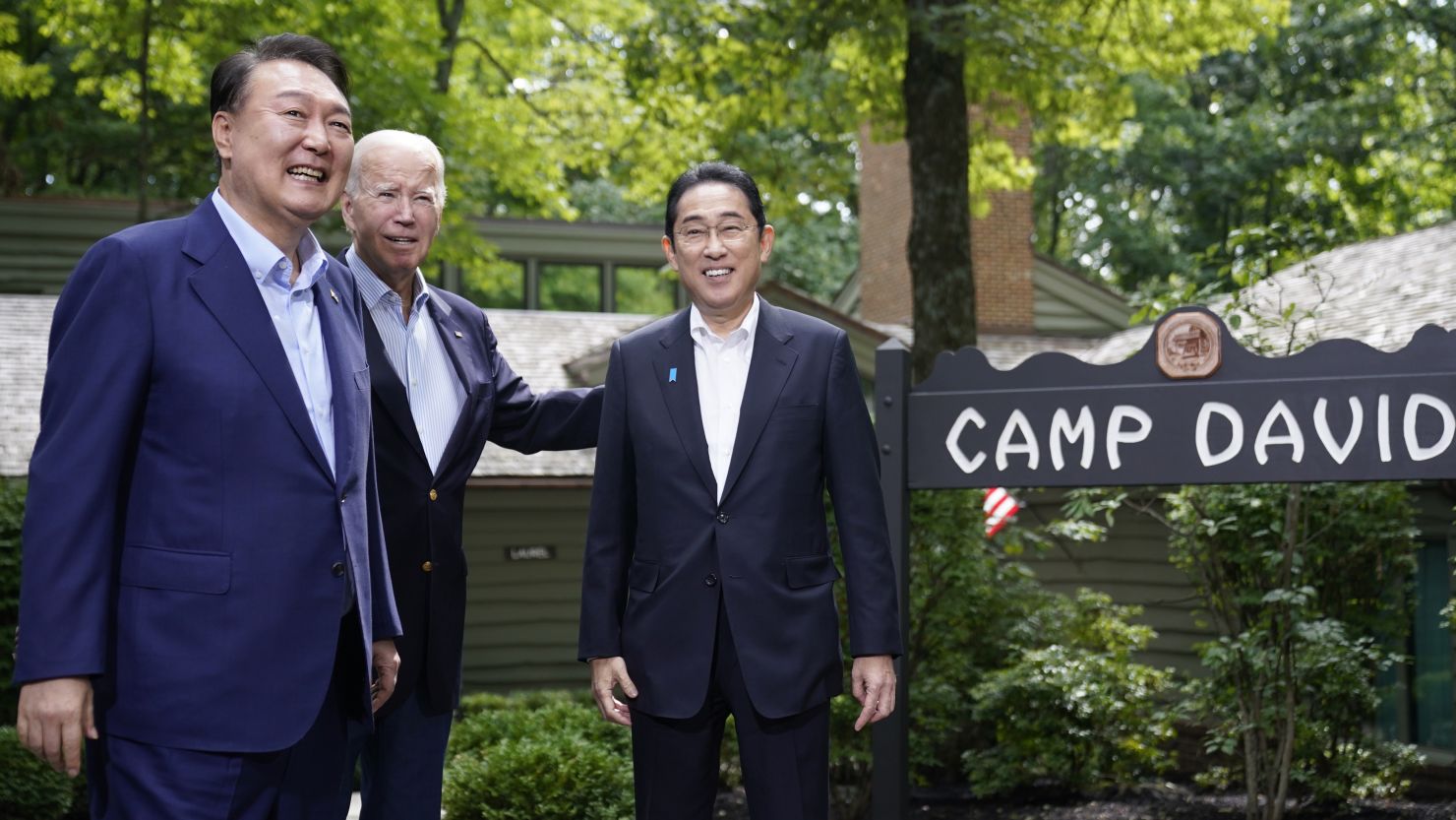 From left, South Korean President Yoon Suk Yeol, US President Joe Biden and Japanese Prime Minister Fumio Kishida meet at Camp David on Friday.