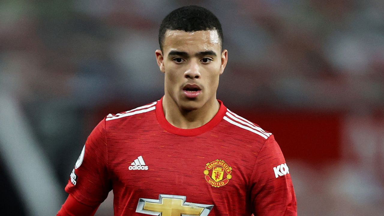 MANCHESTER, ENGLAND - MARCH 14: Mason Greenwood of Manchester United runs with the ball during the Premier League match between Manchester United and West Ham United at Old Trafford on March 14, 2021 in Manchester, England. Sporting stadiums around the UK remain under strict restrictions due to the Coronavirus Pandemic as Government social distancing laws prohibit fans inside venues resulting in games being played behind closed doors. (Photo by Clive Brunskill/Getty Images)