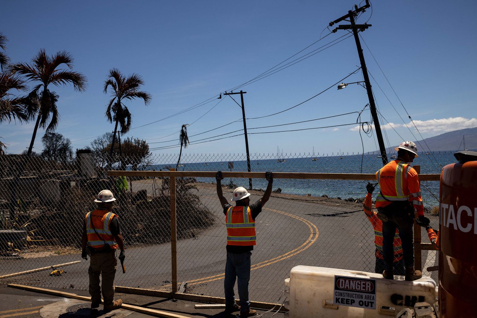 Fences are built around destroyed neighborhoods in Lahaina on August 17.