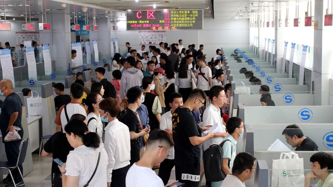 Job seekers look for positions at the 2023 Summer college Graduates Employment and Internship Fair in Suqian, Jiangsu Province, China, Aug. 9, 2023. 