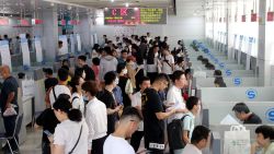 Job seekers look for positions at the 2023 Summer college Graduates Employment and Internship Fair in Suqian, Jiangsu Province, China, Aug. 9, 2023. 