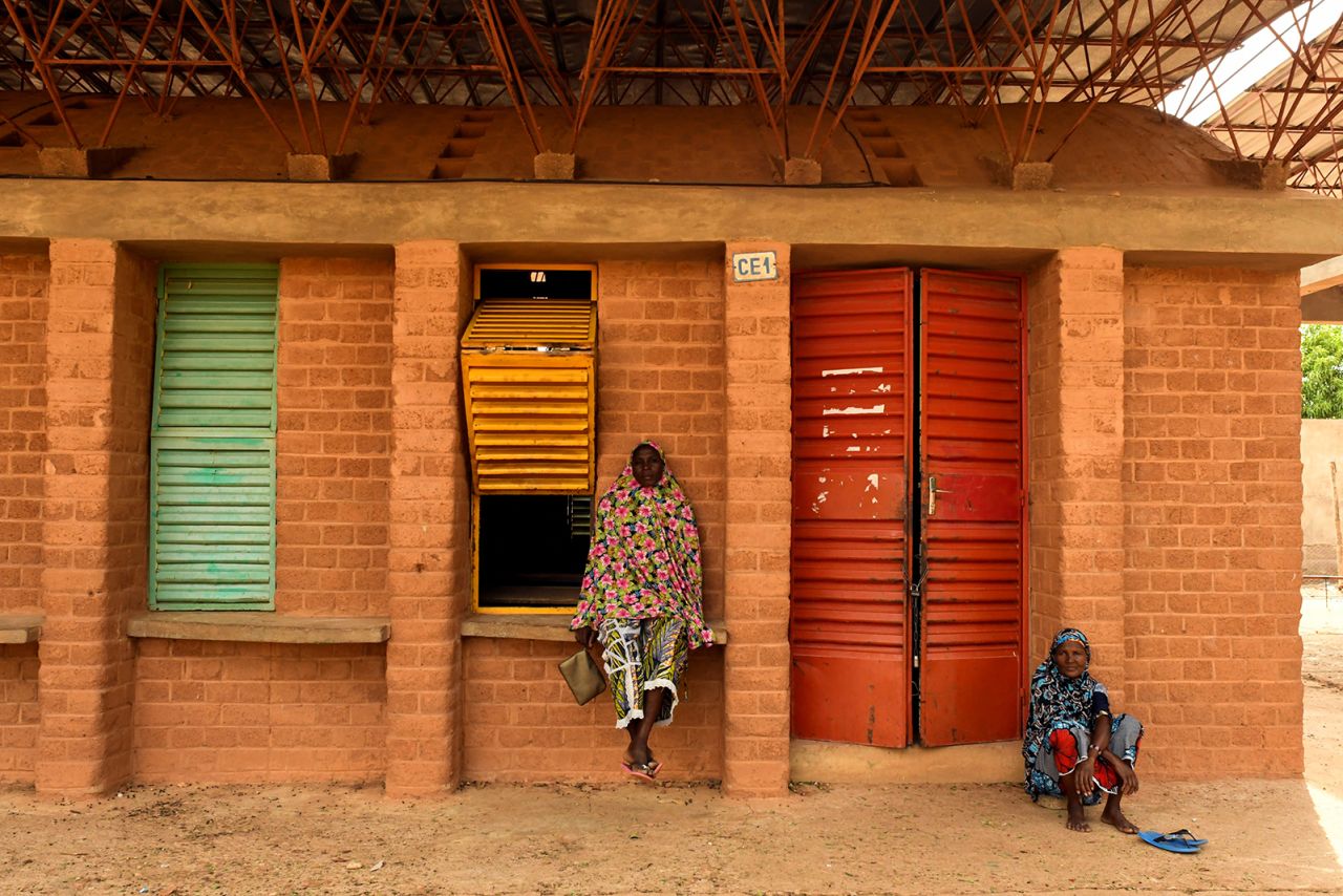 A man waits to attend a ceremony to honor the architect Francis Kere after he won Pritzker Prize in his native village Gando, Burkina Faso June 4, 2022.