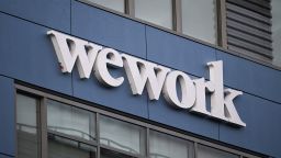 The WeWork logo is displayed outside of a shared commercial office space building in Los Angeles, California on August 8, 2023. Embattled office-sharing firm WeWork on August 8 warned US regulators that it is worried about its survival. Citing financial losses, cash needs, and a drop in memberships, WeWork said in a filing with the Securities and Exchange Commission (SEC) that "substantial doubt exists about the company's ability to continue as a going concern." (Photo by Patrick T. Fallon / AFP) (Photo by PATRICK T. FALLON/AFP via Getty Images)
