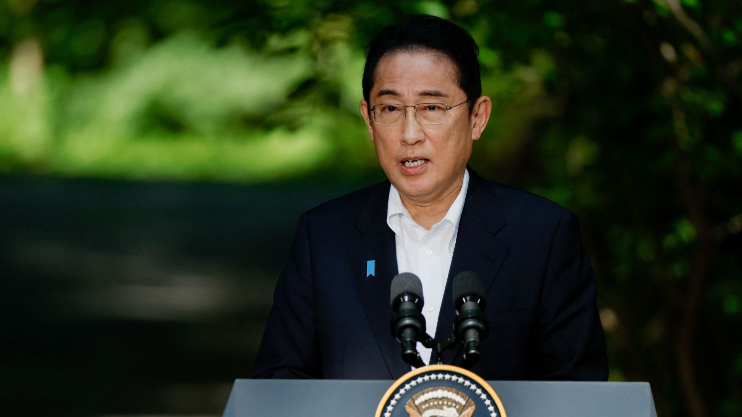 Japanese Prime Minister Fumio Kishida speaks at a joint press conference with US President Joe Biden and South Korean President Yoon Suk Yeol during the trilateral summit at Camp David on August 18.