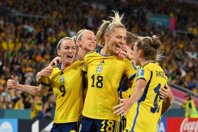 Sweden's Fridolina Rolfo celebrates with teammates after scoring her team's first goal against Australia.