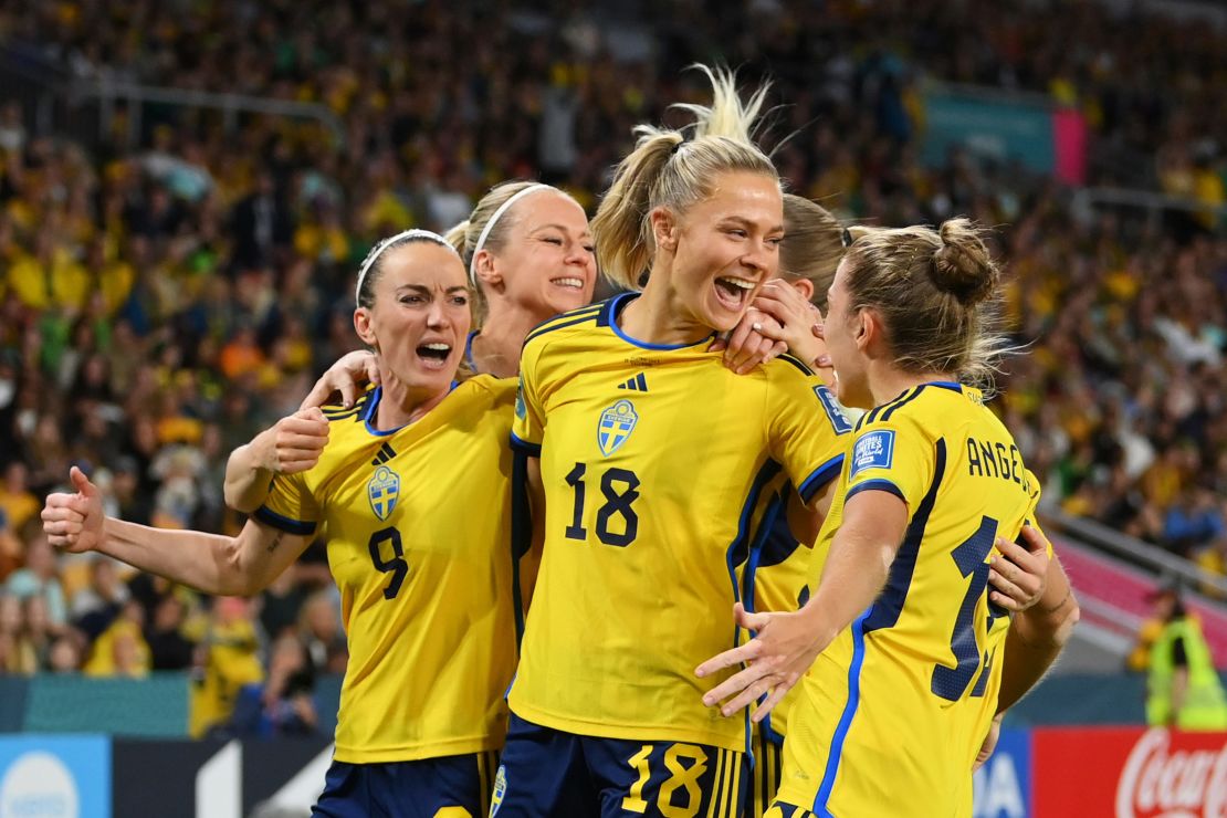 Fridolina Rolfö celebrates with her teammates after scoring.