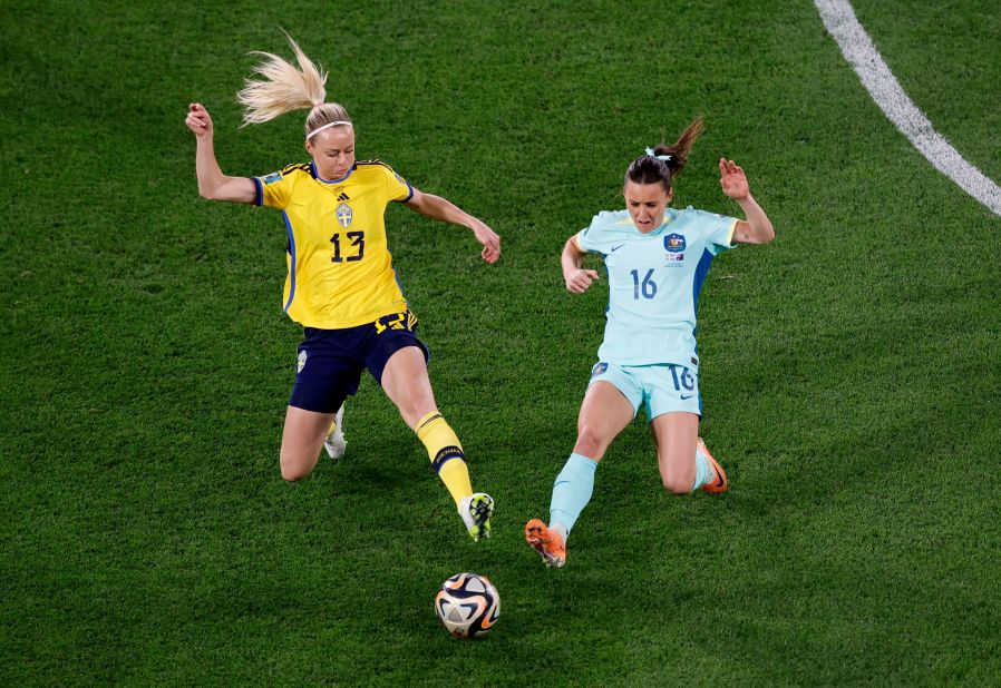 Sweden's Amanda Ilestedt and Australia's Hayley Raso compete for the ball.