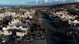In an aerial view, burned cars and homes are seen in a neighborhood that was destroyed by a wildfire on August 18, 2023 in Lahaina, Hawaii. At least 111 people were killed and thousands were displaced after a wind driven wildfire devastated the towns of Lahaina and Kula early last week. Crews are continuing to search for missing people. 