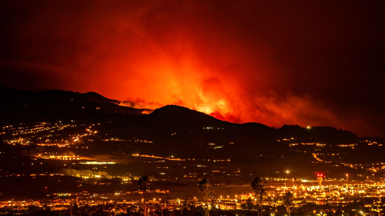 Flares are seen on the horizon as the flames advance through the jungle toward the town of La Laguna and Los Rodeo Airport.