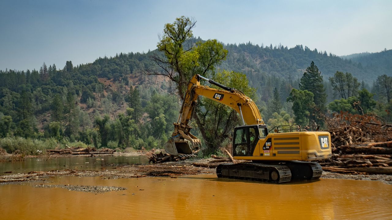 An excavator on the Trinity River.