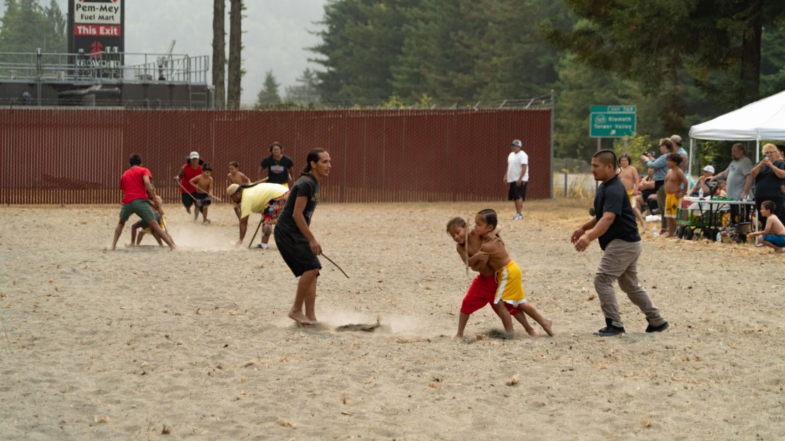 Kids play a traditional Yurok sport known as the "stick game" at the Salmon Festival in Klamath, California.