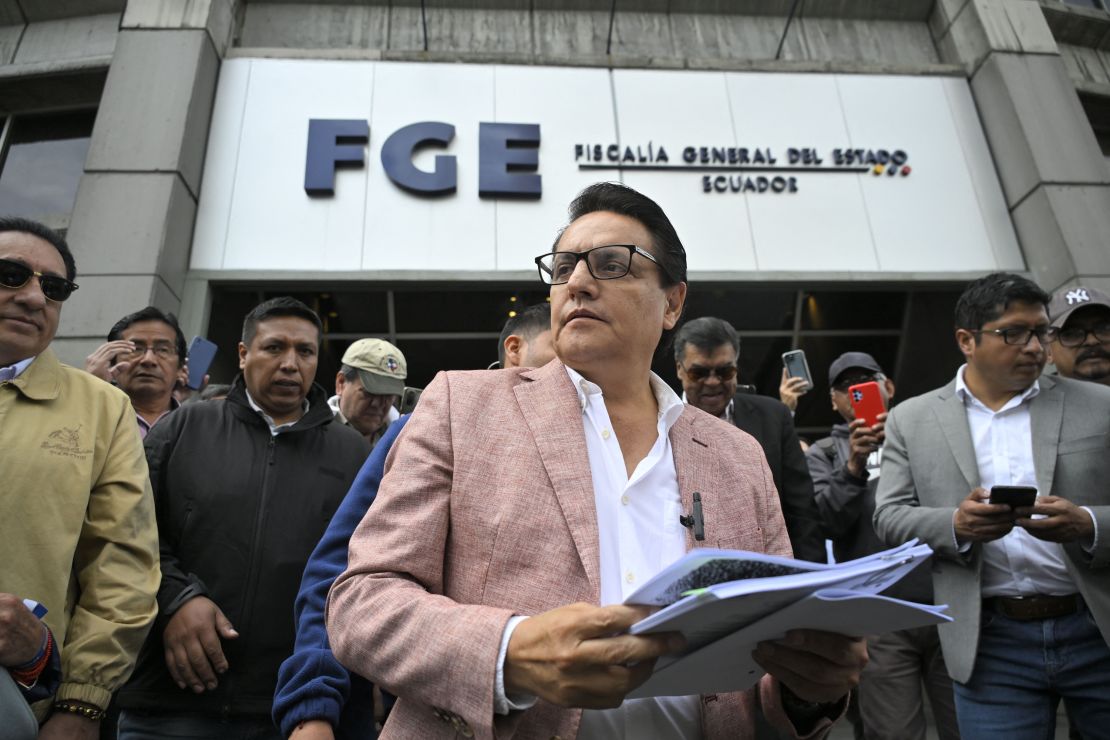 TOPSHOT - Former Assembly member and now presidential candidate, Fernando Villavicencio, speaks to journalists upon his arrival at the Attorney General's Office in Quito on August 8, 2023. Fernando Villavicencio asked the Attorney General's Office to investigate former officials related to the oil sector of the governments of Rafael Correa, Lenín Moreno, and Guillermo Lasso as part of a criminal complaint that he filed on Tuesday. (Photo by Rodrigo BUENDIA / AFP) (Photo by RODRIGO BUENDIA/AFP via Getty Images)