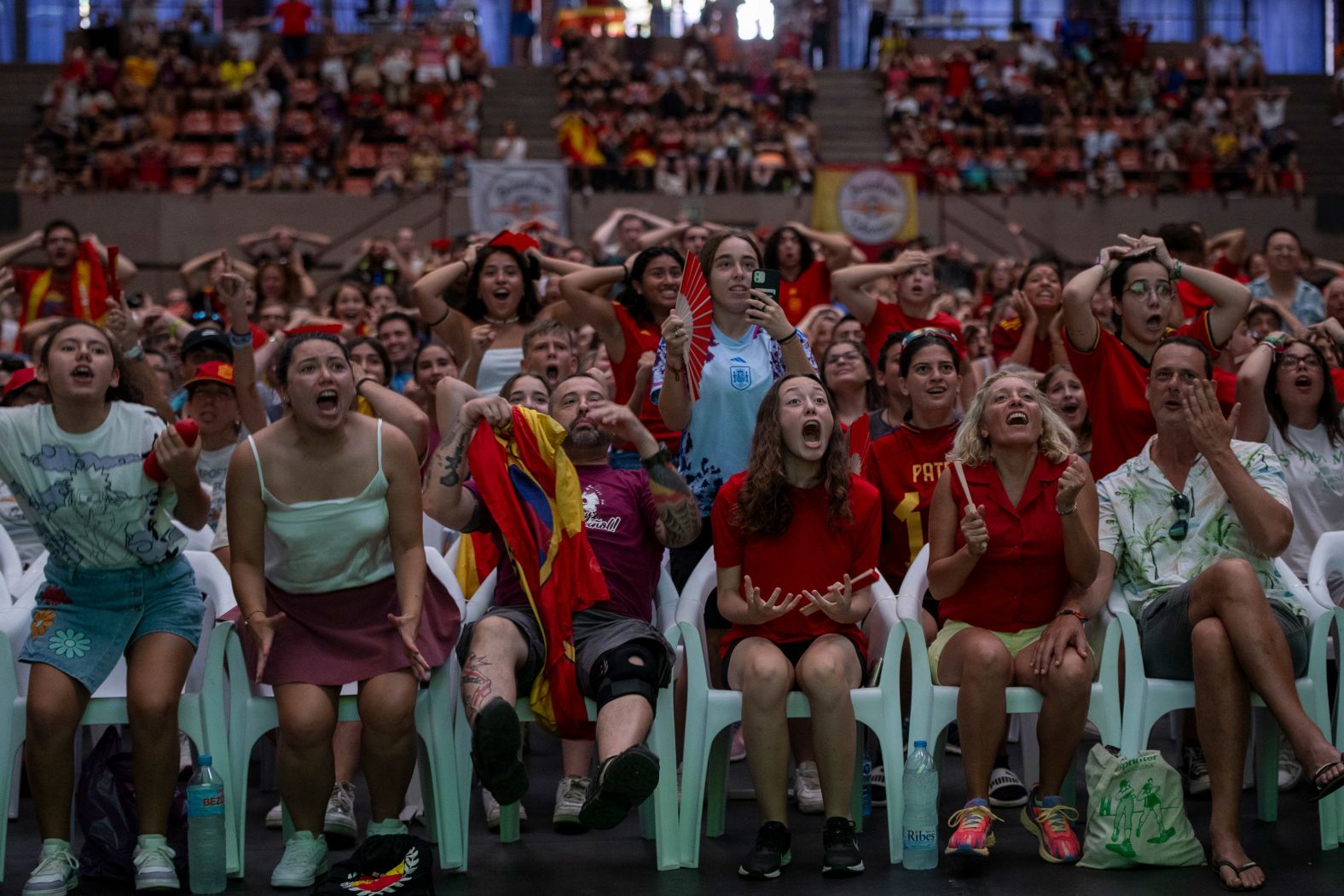 Fans cheer for Spain during a broadcast of match in Barcelona.