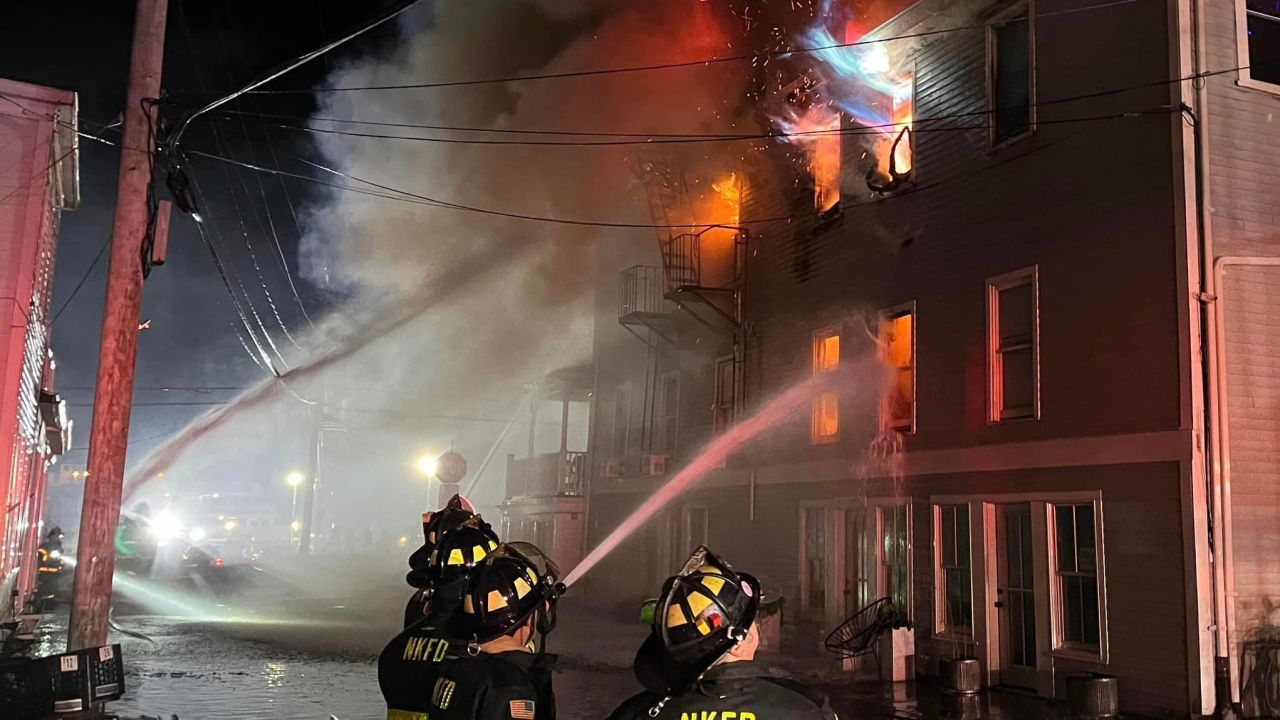 Firefighters work to extinguish a fire on Block Island, Rhode Island.