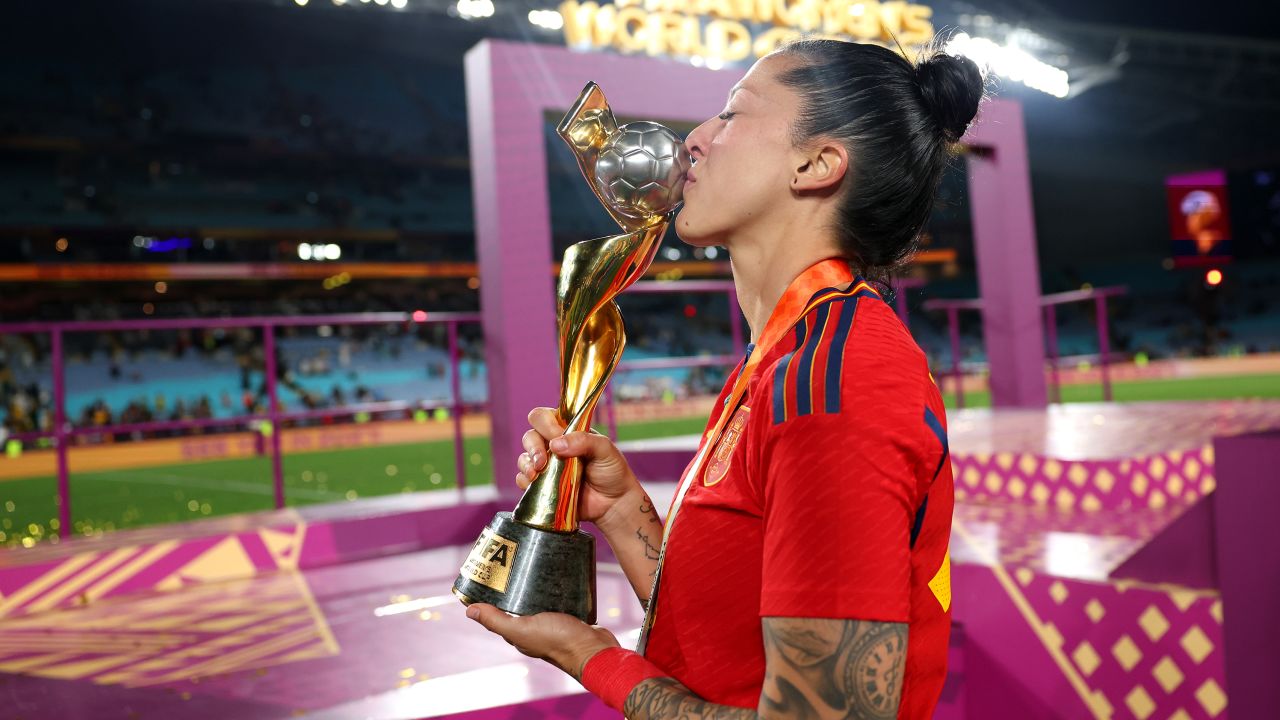 Jennifer Hermoso kisses the Women's World Cup trophy.