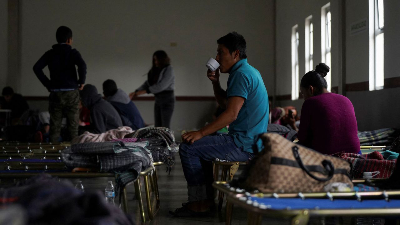 People sit at Peregrino shelter as Tropical Storm Hilary hits Baja California state, in Mexicali, Mexico.