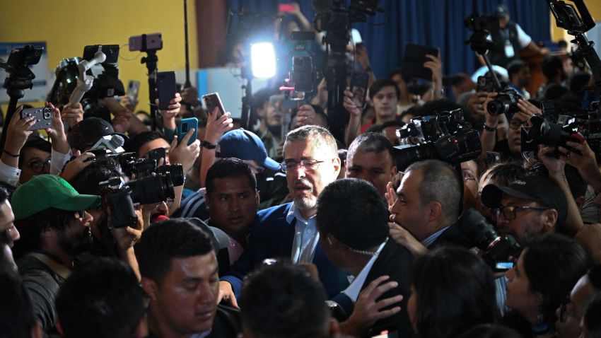 Guatemala's presidential candidate for the Semilla party, Bernardo Arevalo (C), arrives to vote at a polling station in Guatemala City during the Guatemalan presidential run-off election on August 20, 2023. Guatemalans vote on Sunday in a presidential runoff tainted by efforts to disqualify the surprise frontrunner, whose promise to crack down on corruption has fired up voters. Reformist outsider Bernardo Arevalo pulled off a massive upset by finishing second in the first round, and will face off against Sandra Torres in the runoff. (Photo by Johan ORDONEZ / AFP) (Photo by JOHAN ORDONEZ/AFP via Getty Images)