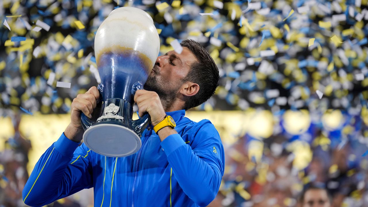 Novak Djokovic kisses the Rookwood Cup after defeating Carlos Alcaraz during the men's singles final of the Western & Southern Open tennis tournament, Sunday, Aug. 20, 2023, in Mason, Ohio. 