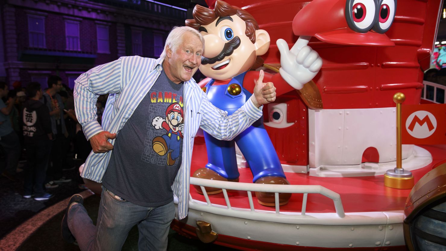 Actor Charles Martinet, the voice of Nintendo Co.'s Mario, stands for a photograph with Mario dduring the E3 Electronic Entertainment Expo in Los Angeles, California, U.S., on Tuesday, June 13, 2017. Nintendo announced a slate of new titles for its new hybrid console Switch, moving to capitalize on early excitement for its newest video-game system. Photographer: Patrick T. Fallon/Bloomberg via Getty Images