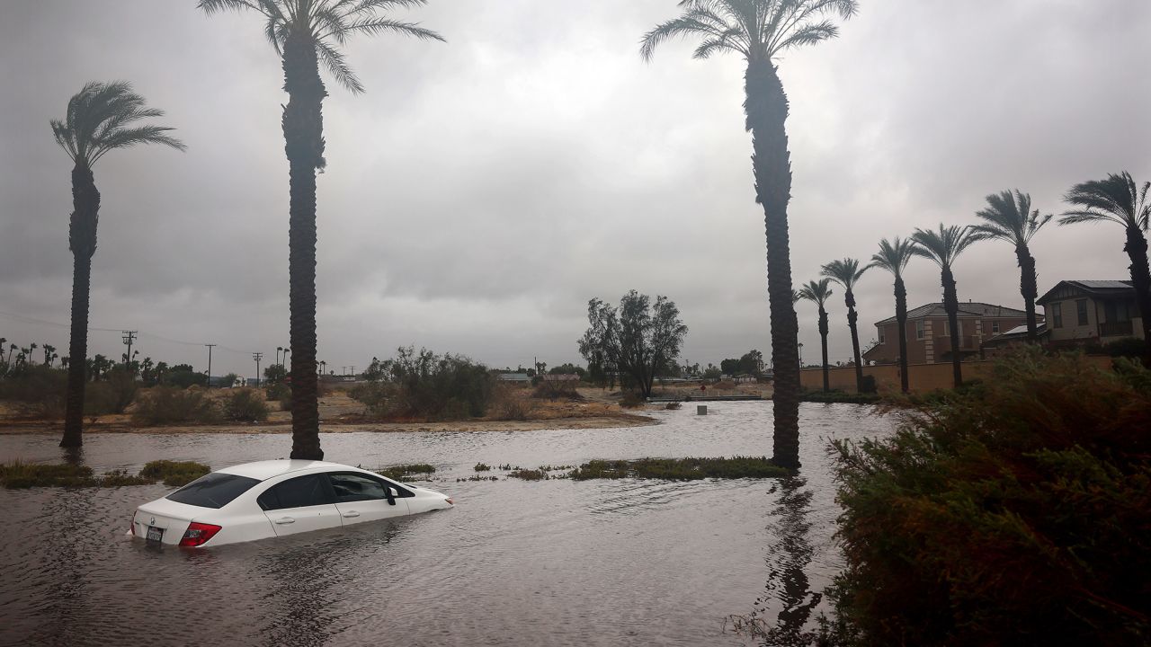A car is partially submerged in floodwaters as Tropical Storm Hilary moves through the area on August 20, 2023 in Cathedral City, California. Southern California is under a first-ever tropical storm warning as Hilary impacts parts of California, Arizona and Nevada. All California state beaches have been closed in San Diego and Orange counties in preparation for the impacts from the storm which was downgraded from hurricane status.