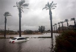 A car is partially submerged in floodwaters as Tropical Storm Hilary moves through the area on August 20, 2023 in Cathedral City, California. Southern California is under a first-ever tropical storm warning as Hilary impacts parts of California, Arizona and Nevada. All California state beaches have been closed in San Diego and Orange counties in preparation for the impacts from the storm which was downgraded from hurricane status. 