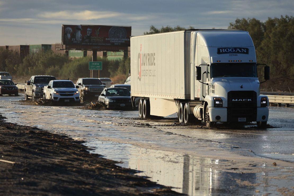 Traffic is slowed as water and mud from Tropical Storm Hilary covers part of Interstate 10, between Indio and Palm Springs, California, on Monday.