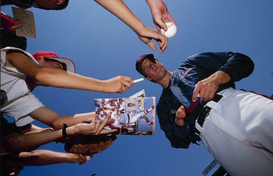 ANAHEIM, CA - 1989:  Jim Abbott of the California Angels signs autographs before a game in the 1989 season at Anaheim Stadium in Anaheim, California. (Photo by Scott Halleran/Getty Images)