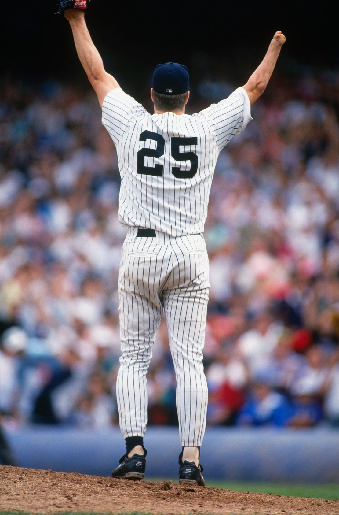 BRONX, NY - SEPTEMBER 4:  Jim Abbott #25, pitcher for the New York Yankees, raises his arms in celebration after pitching a no hitter against the Cleveland Indians at Yankee Stadium on September 4, 1993 in Bronx, New York. (Photo by Focus on Sport via Getty Images)