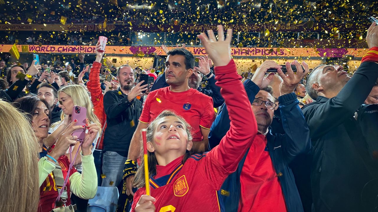 A young Spain supporter celebrates the victory of La Roja against England in the World Cup final.