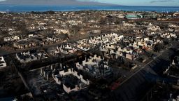 In an aerial view, burned cars and homes are seen in a neighborhood destroyed by a wildfire on August 18, 2023 in Lahaina, Hawaii.