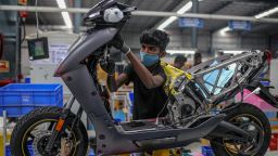 An employee assembles an Ather Energy 450X electric scooter at the company's manufacturing facility in Hosur, India, on Tuesday, Feb. 22, 2022. In India, electric vehicles accounted for approximately 15,000 of the 3.1 million passenger vehicles sold in 2021, a 200% increase in sales over the previous year. 