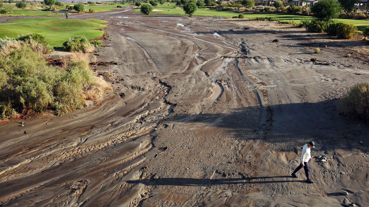 Tropical storm Hilary caused a section of the normally-dry Whitewater River to flood parts of a golf course in Cathedral City, California. (Photo by Mario Tama/Getty Images)