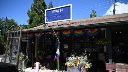 A Pride flag ripped off its flag pole is seen outside the entrance to the Mag.Pi clothing store is seen in Cedar Glen, near Lake Arrowhead, California, on August 21, 2023.